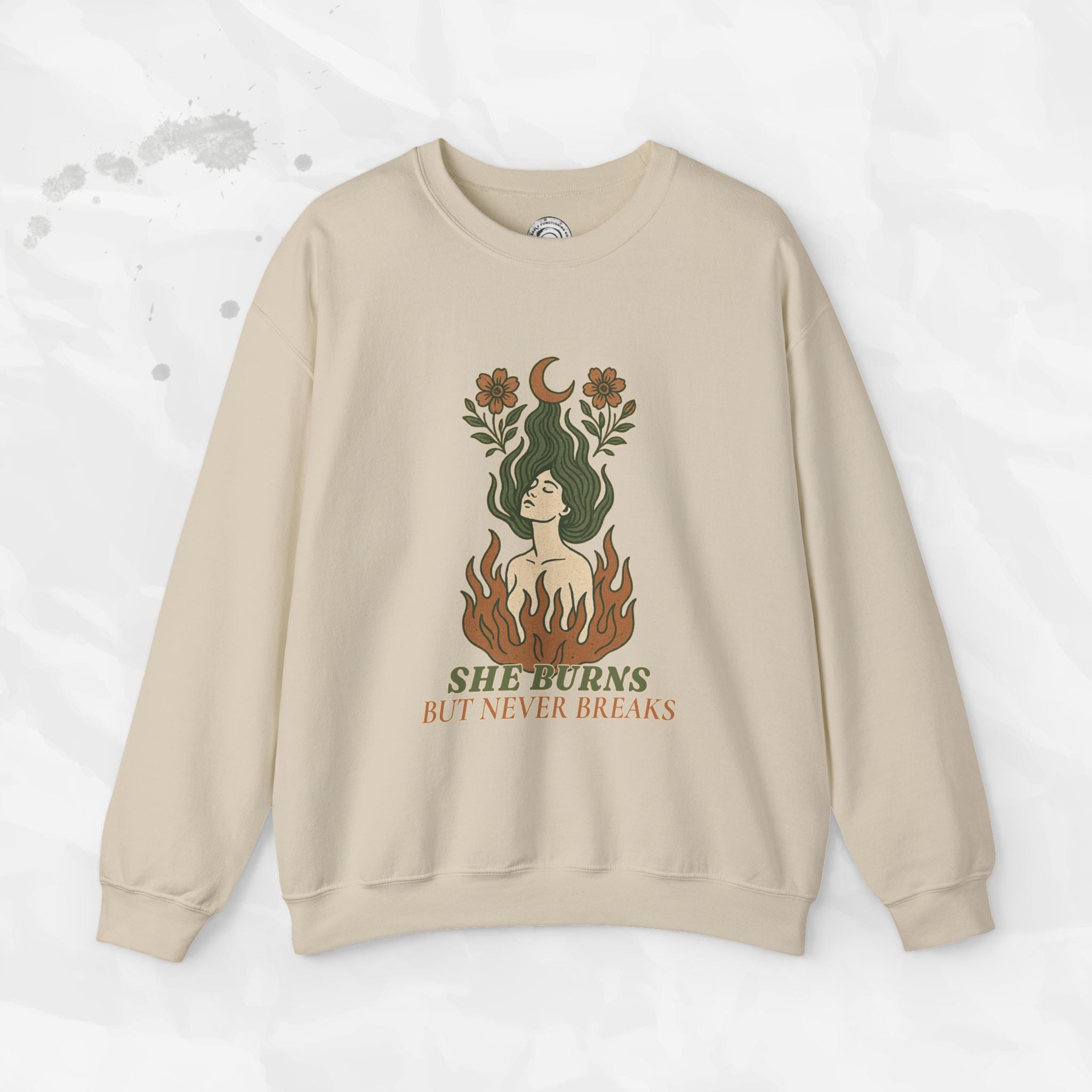 Beige sweatshirt with a graphic design of a woman with flames and text on a white background
