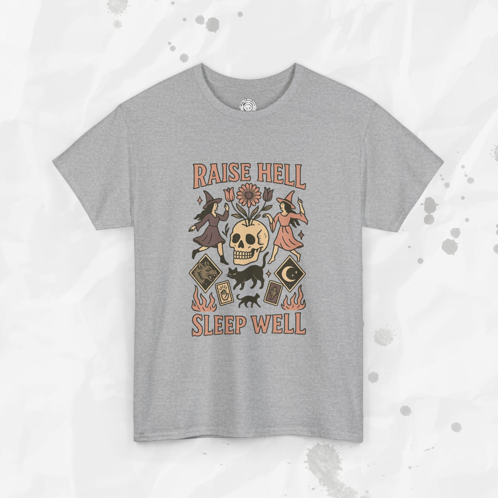 Gray t-shirt with graphic design and text 'Raise Hell Sleep Well' on a light gray background