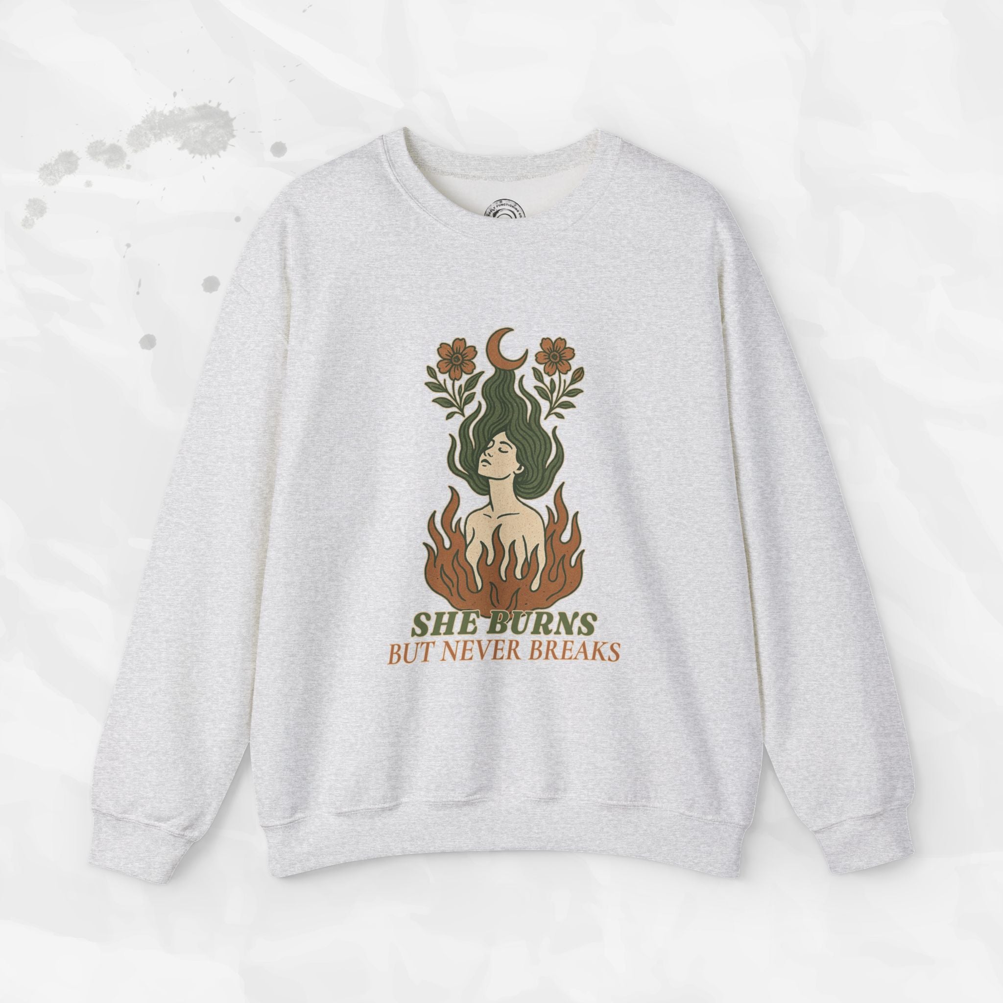 She Burns But Never Breaks – Crewneck Sweatshirt