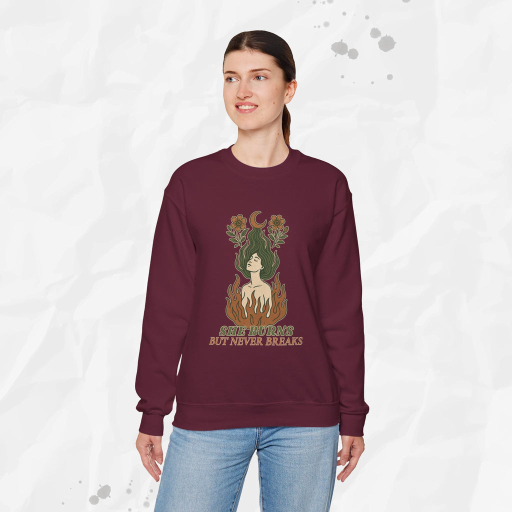 She Burns But Never Breaks – Crewneck Sweatshirt