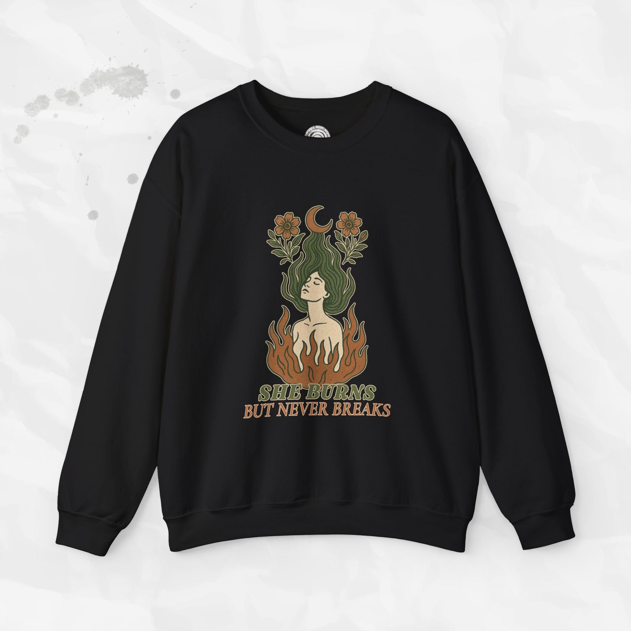 She Burns But Never Breaks – Crewneck Sweatshirt