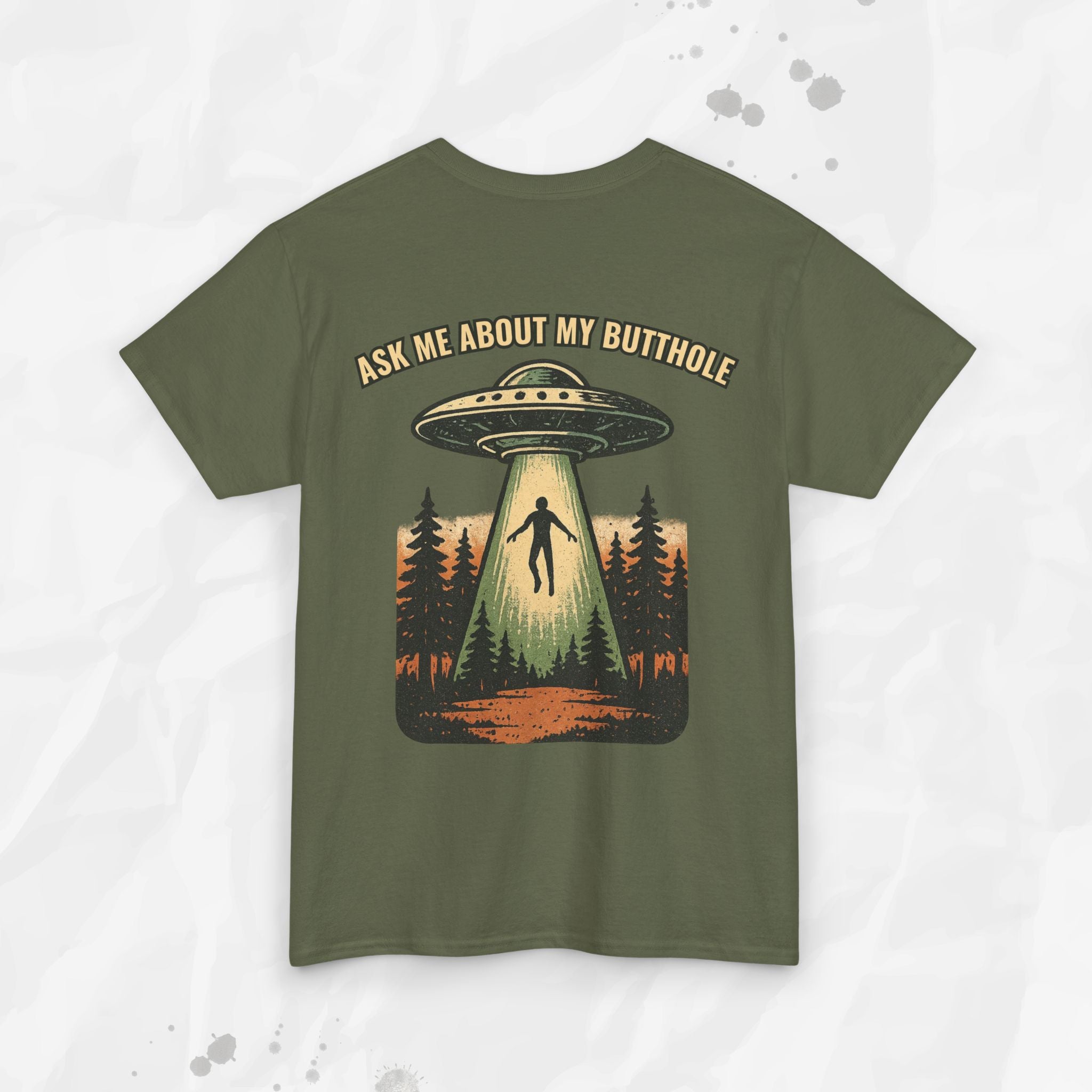 Green t-shirt with UFO graphic and text 'Ask me about my butthole' on a light gray background